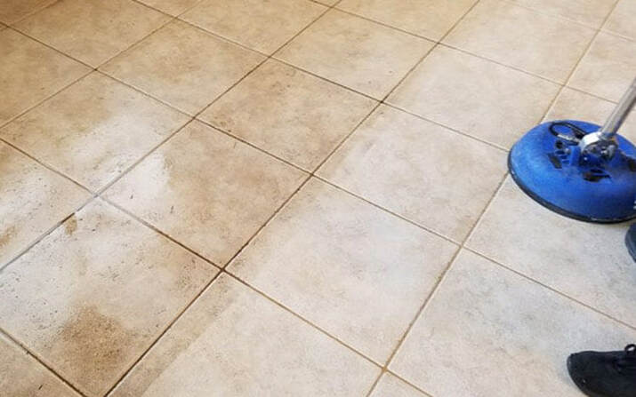a dirty tile floor being cleaned in surprise az